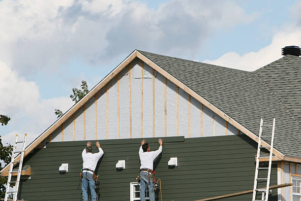 Professional Storm Damage Siding Repair technician working in Farmville, VA